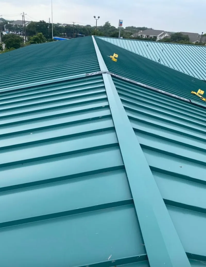 Green commercial metal roof ridge and valley for Metal Roof Repair in Hollis