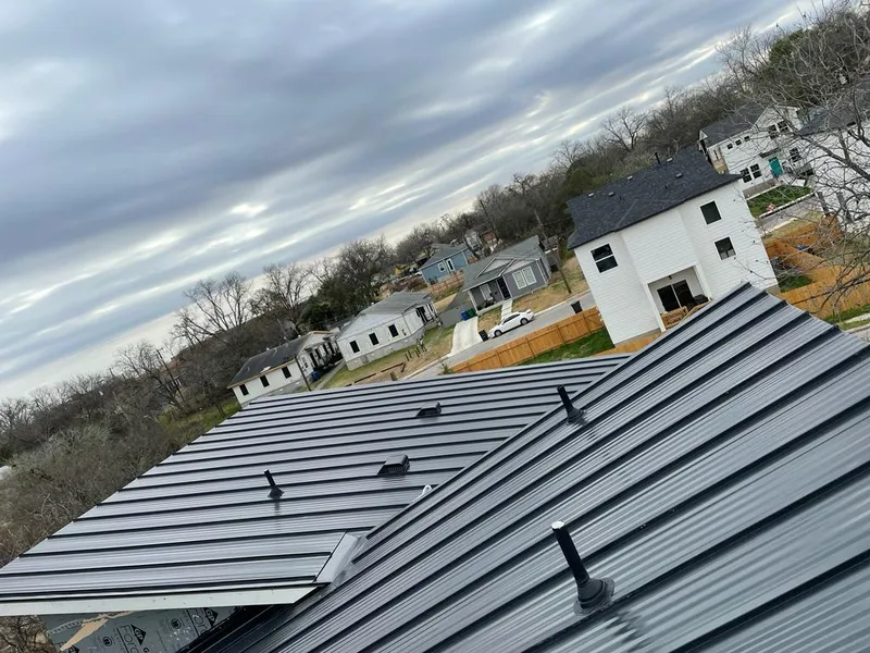 Standing seam metal roof panels with vents for Skylight Repair in Hollis